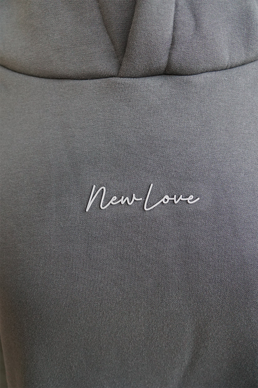 Sudadera oversize con capucha negra lavada de goma